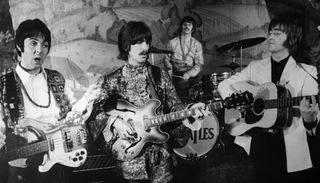 (from left) Paul McCartney, George Harrison, Ringo Starr and John Lennon perform at the Saville Theatre in London in 1968