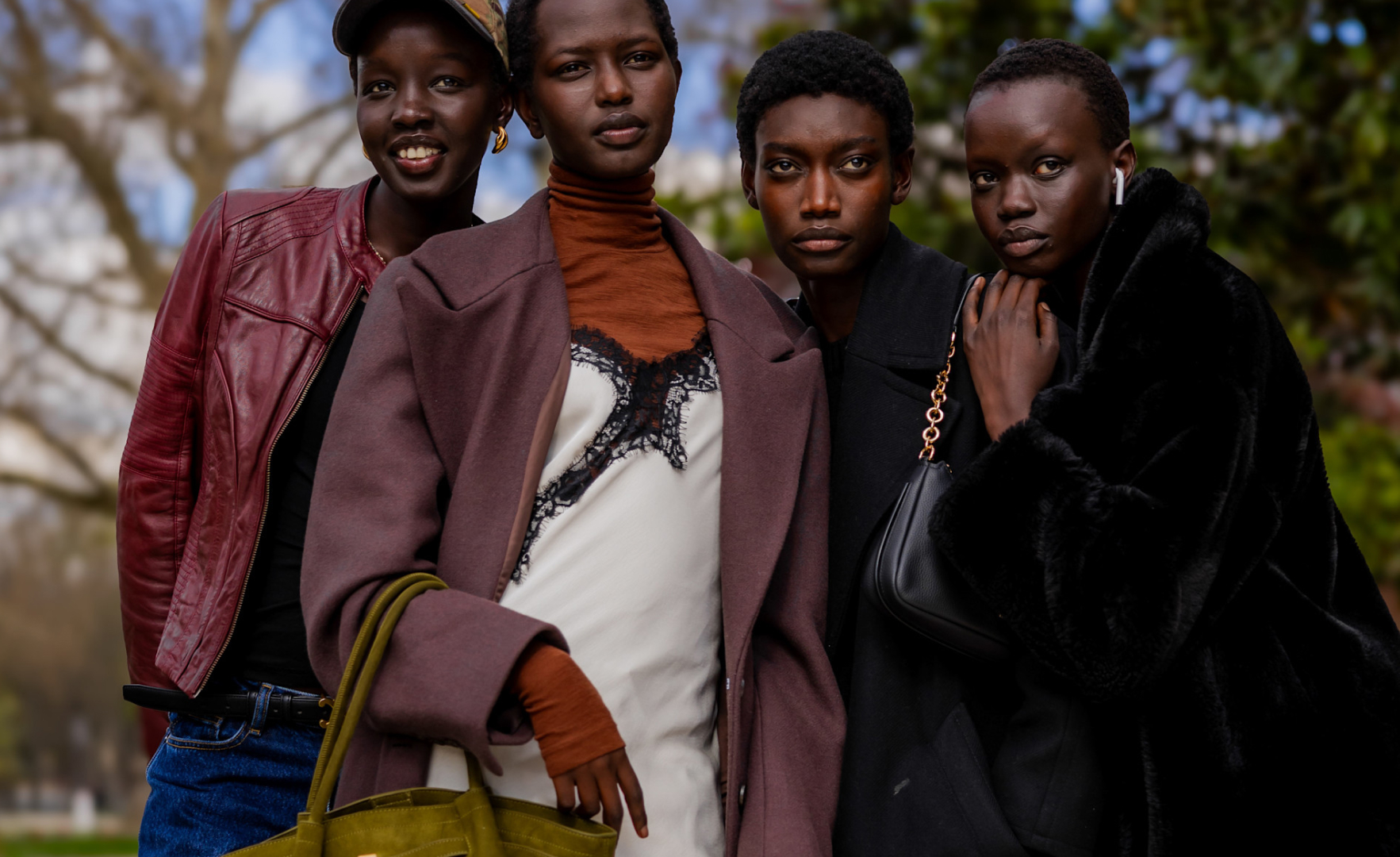 four girls wearing jackets