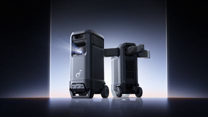 Promotional rendered image of the Soundcore Nebula X1 Pro showing two units coming out of a brightly lit space