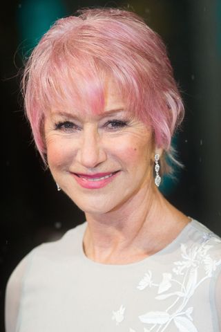 Helen Mirren is pictured with a pink pixie cut at the EE British Academy Film Awards at The Royal Opera House on February 10, 2013 in London, England.