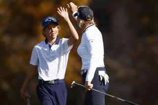 Annika Sorenstam high fives her son, Will