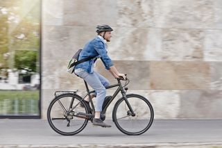 Male cyclist riding a flat bar bike