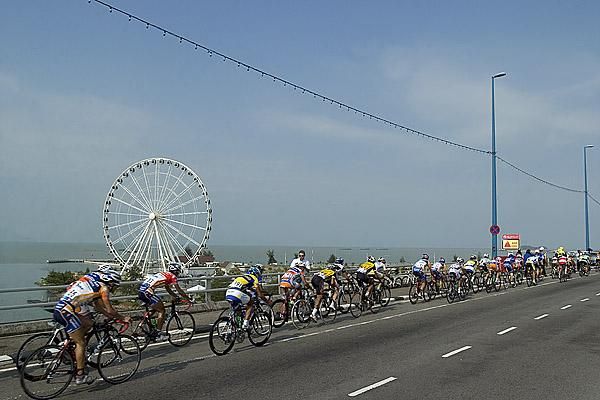 The peloton pass the Eye of Malaysia near Melaka during stage five of the tour.