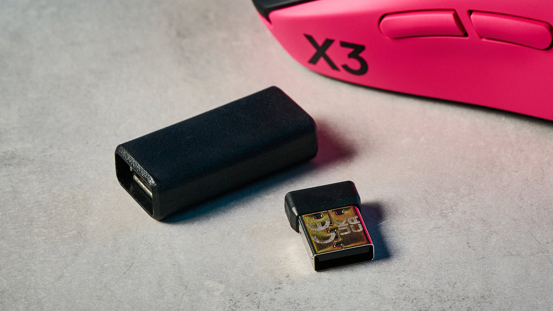 The Logitech G Pro X3 SuperStrike on a stone surface