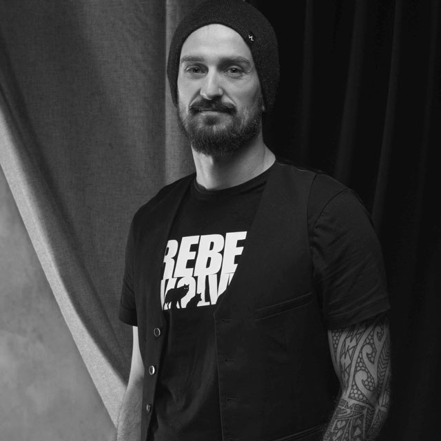 Headshot of Konrad Tomaszkiewicz, game director and CEO at Rebel Wolves