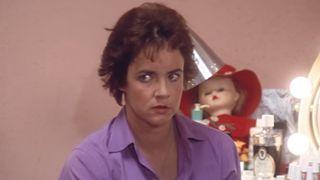 Stockard Channing as Rizzo embarrassed to be caught by Sandy in Grease.