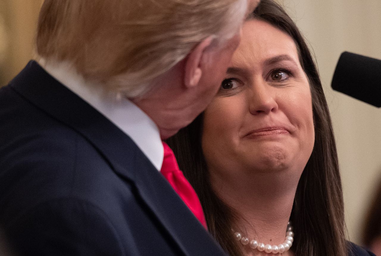 President Trump and Sarah Huckabee Sanders.