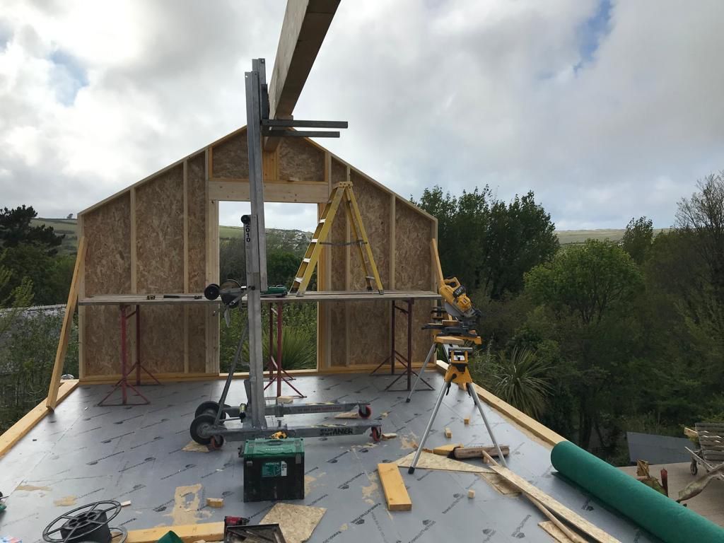 The upper floor of a timber framed with a glulam beam running the full length of the ridge.