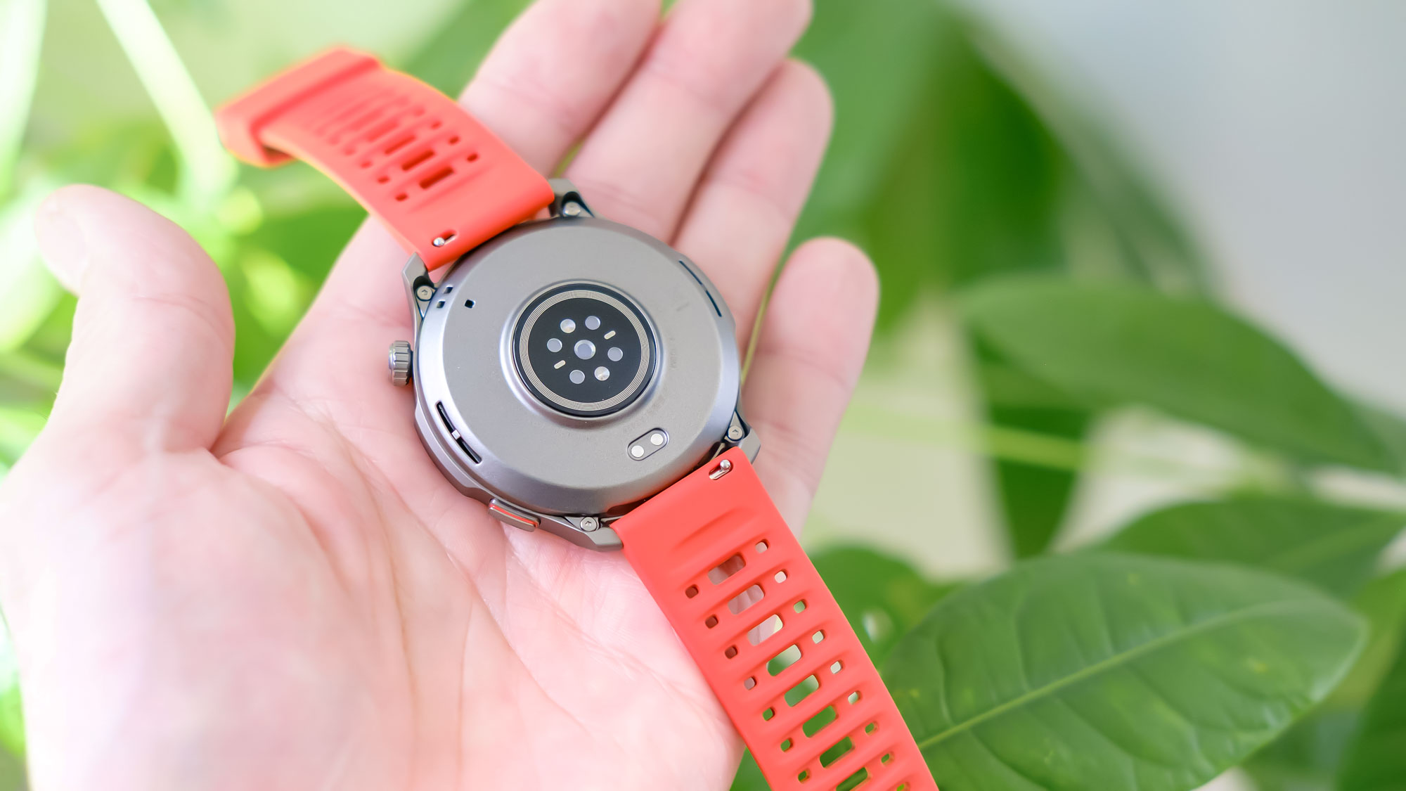 Close-up of the Amazfit Balance 2 smartwatch on an orange rubber strap