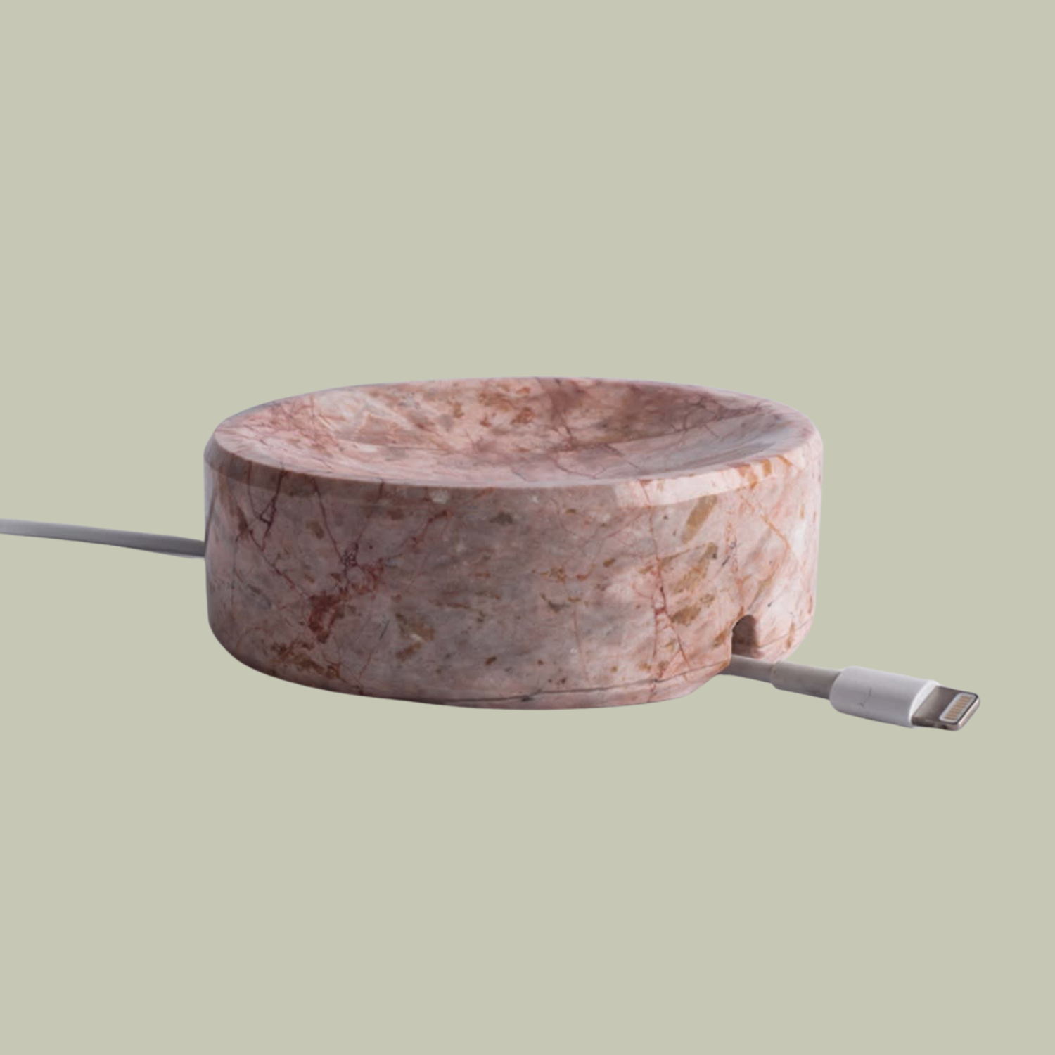 A pink marble cable holder
