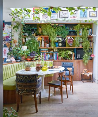 kitchen diner with green banquette and shelves
