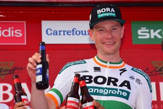 Sam Bennett (Bora-Hansgrohe) with the spoils of victory