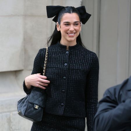 Dua Lipa wears right and open-toe sandals to the Chanel Haute Couture SS25 runway show in Paris.