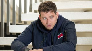 Buck sitting on steps on 9-1-1.