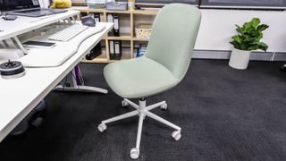 Koala Upright office chair in green by a white desk
