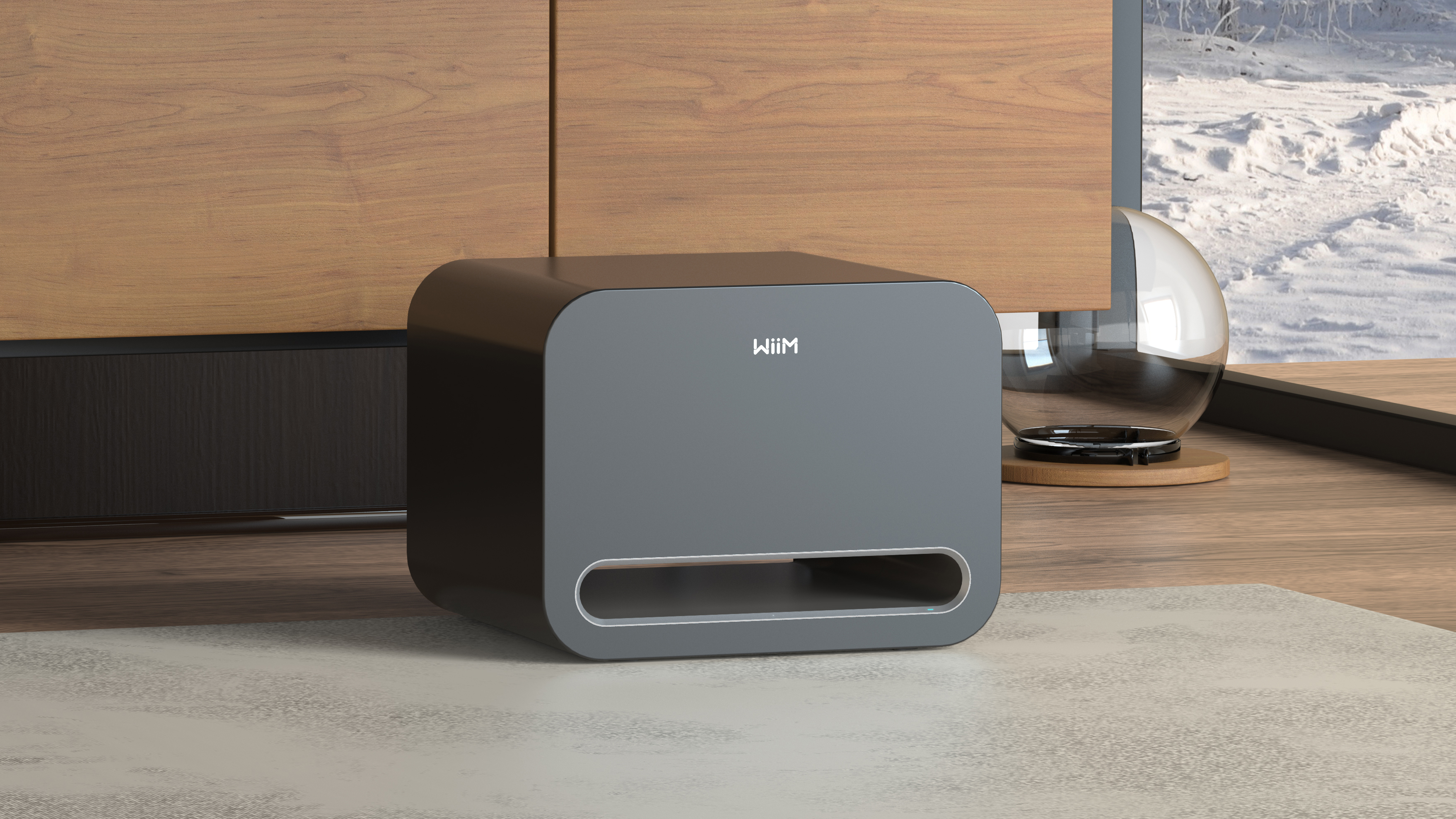 The WiiM Sub Pro in front of a TV unit