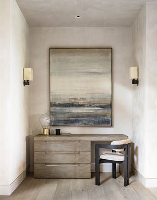 A corner in a room with walls painted in lime wash finish