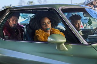 (L to R) Jamie Foxx, Teyonah Parris and John Boyega in a car in They Clone Tyrone, a new Netflix movie coming on July 21, 2023