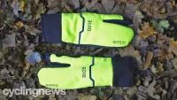 Pair of Gore-Tex Infinium Split gloves on a leafy ground