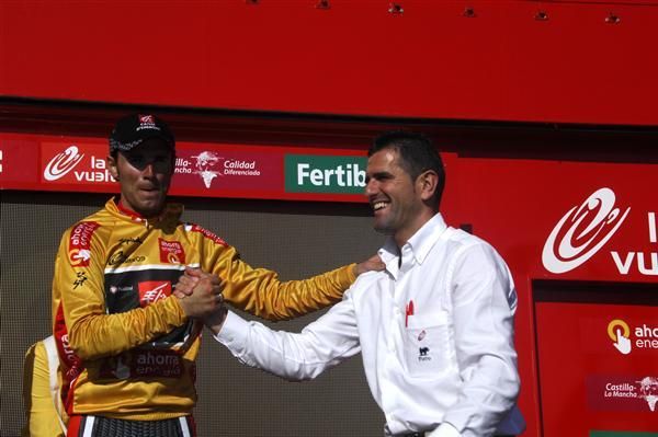 Alejandro Valverde (Caisse d'Epargne) is congratulated on the podium by Abraham Olano