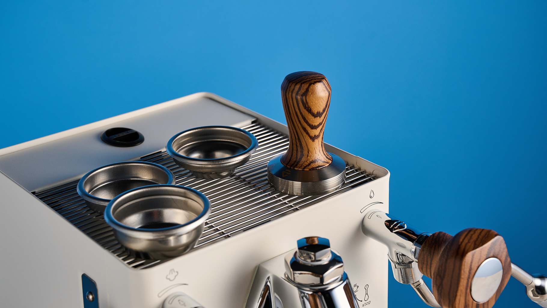 the lelit mara x3 in white and walnut photographed against a blue tom's guide background