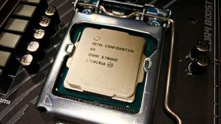 Photograph of a naked CPU in a motherboard socket.