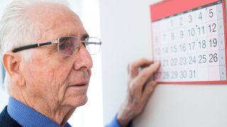 Dementia - forgetting at a wall calendar