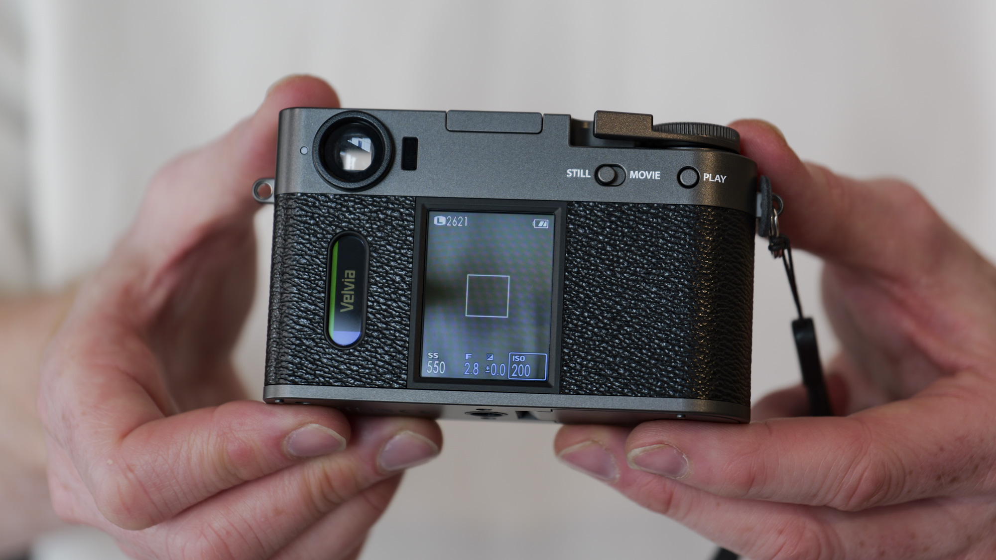 Fujifilm X half compact camera in the hand