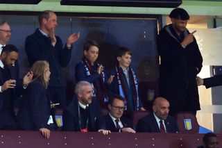 Prince William, Prince of Wales and Prince George of Wales look on alongside Tyrone Mings of Aston Villa during the UEFA Europa Conference League 2023/24 Quarter-final first leg match between Aston Villa and Lille OSC at Villa Park on April 11, 2024 in Birmingham, England