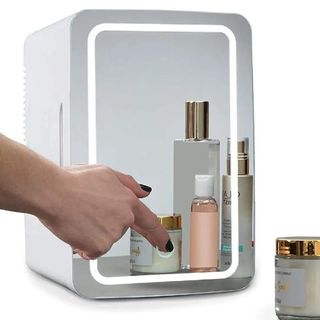 A silver portable cosmetic fridge with a LED light mirror on the front is one of the best beauty gifts for her.