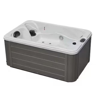 A Luxury Spas Cashmere 2-Person 15 Jet Lounger Hot Tub on a white background