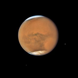 Mars' closest approach to Earth since 2003 has given us especially detailed, up-close views of the Red Planet. This recent image from NASA's Hubble Space Telescope shows Mars and its ongoing dust storm in incredible detail.