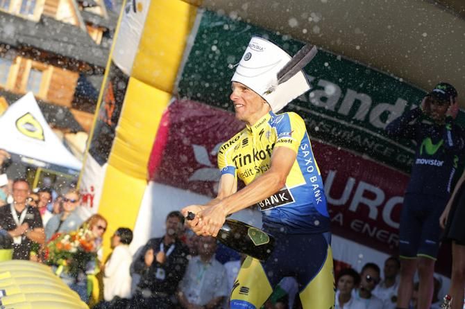 Rafal Majka (Tinkoff - Saxo) celebrates with a bottle of champagne
