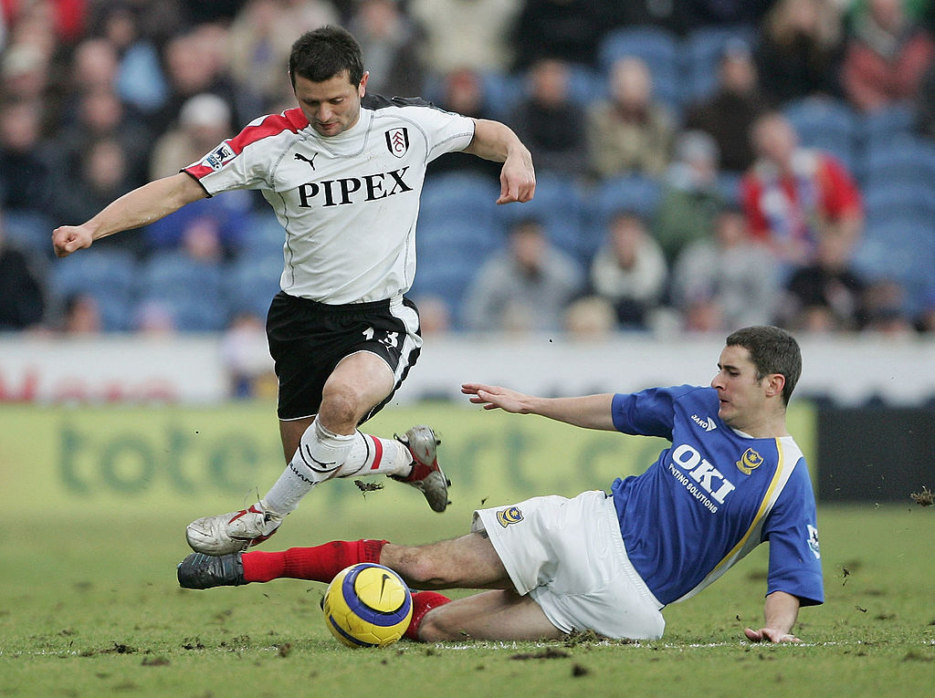 Tomasz Radzinski of Fulham takes on Andy Griffin of Portsmouth during the Barclays Premiership match between Portsmouth and Fulham at Fratton Park on December 31, 2005 in Portsmouth, England.