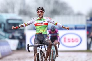 Belgian Sanne Cant celebrates as she crosses the finish line to win the women's elite and U23 race at the Belgian Championships cyclocross cycling in Meulebeke, on Saturday 13 January 2024. BELGA PHOTO DAVID PINTENS (Photo by DAVID PINTENS / BELGA MAG / Belga via AFP)