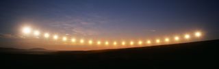 Multiple exposure of midnight sun passing due north on a summer night 175 miles north of Arctic Circle. | Location: Toolik Lake, Alaska, USA.