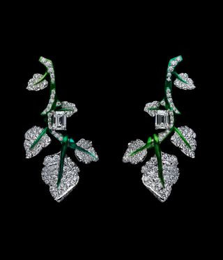 Green earrings with diamonds on the stems