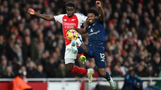 Bukayo Saka of Arsenal battles for possession with Tyrell Malacia of Manchester United 