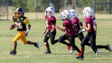 Kids play football in Texas. 
