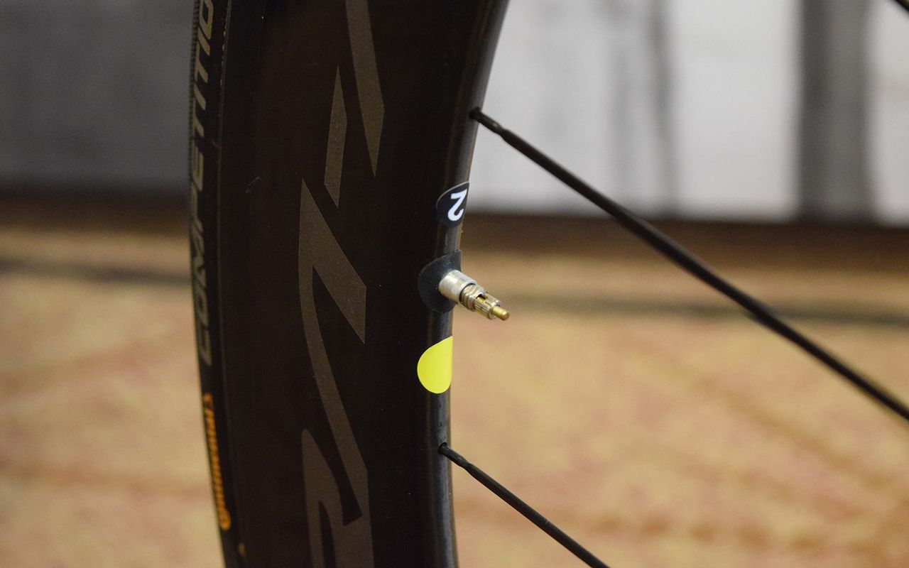 Different colour stickers on wheels denote race wheels versus training wheels
