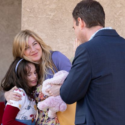 ellen pompeo as kristine barnett hugging her adoptive daughter natalia grace, played by imogen faith reid, while mark duplass as michael barnett looks on