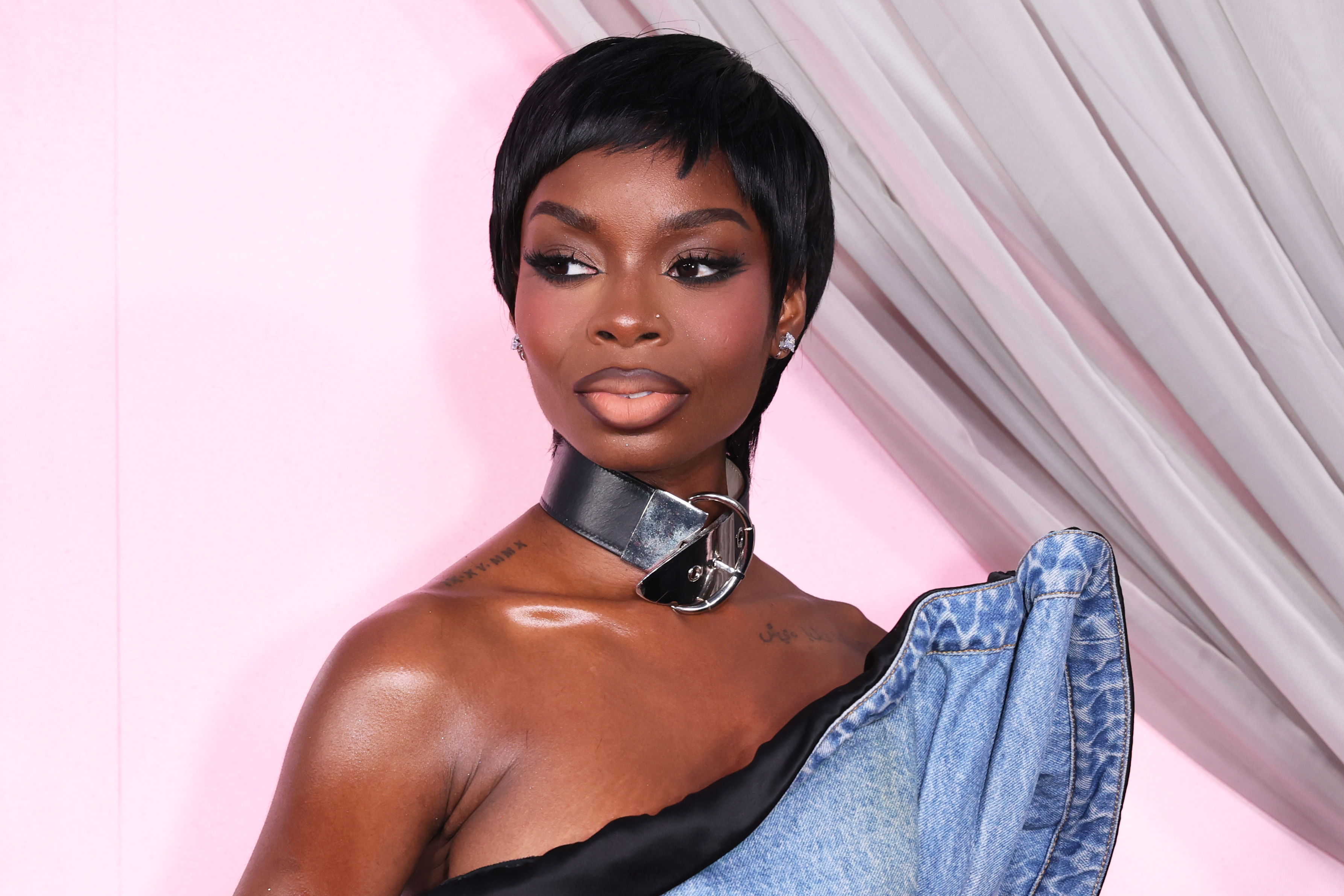 a black woman with a short pixie cut