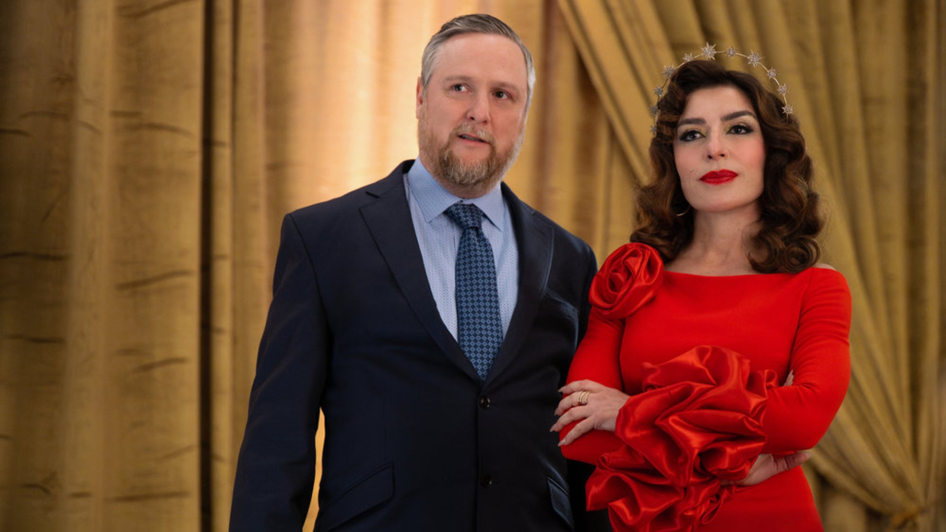 Esmeralda and Ken stand together in The Paper season 1