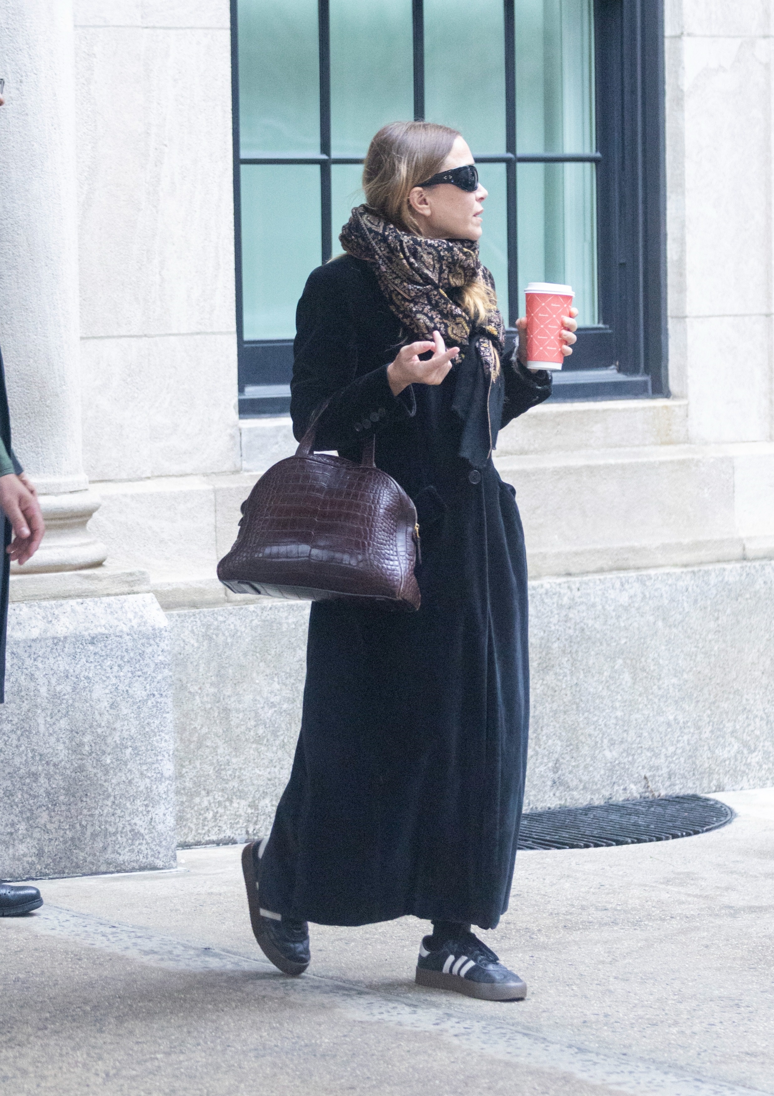 Mary-Kate Olsen was spotted in New York City wearing a velvet coat, Adidas sneakers, and a croc The Row bag