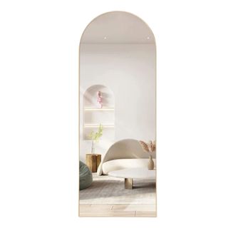 A full-length arched mirror