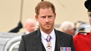 prince harry arrives at the coronation