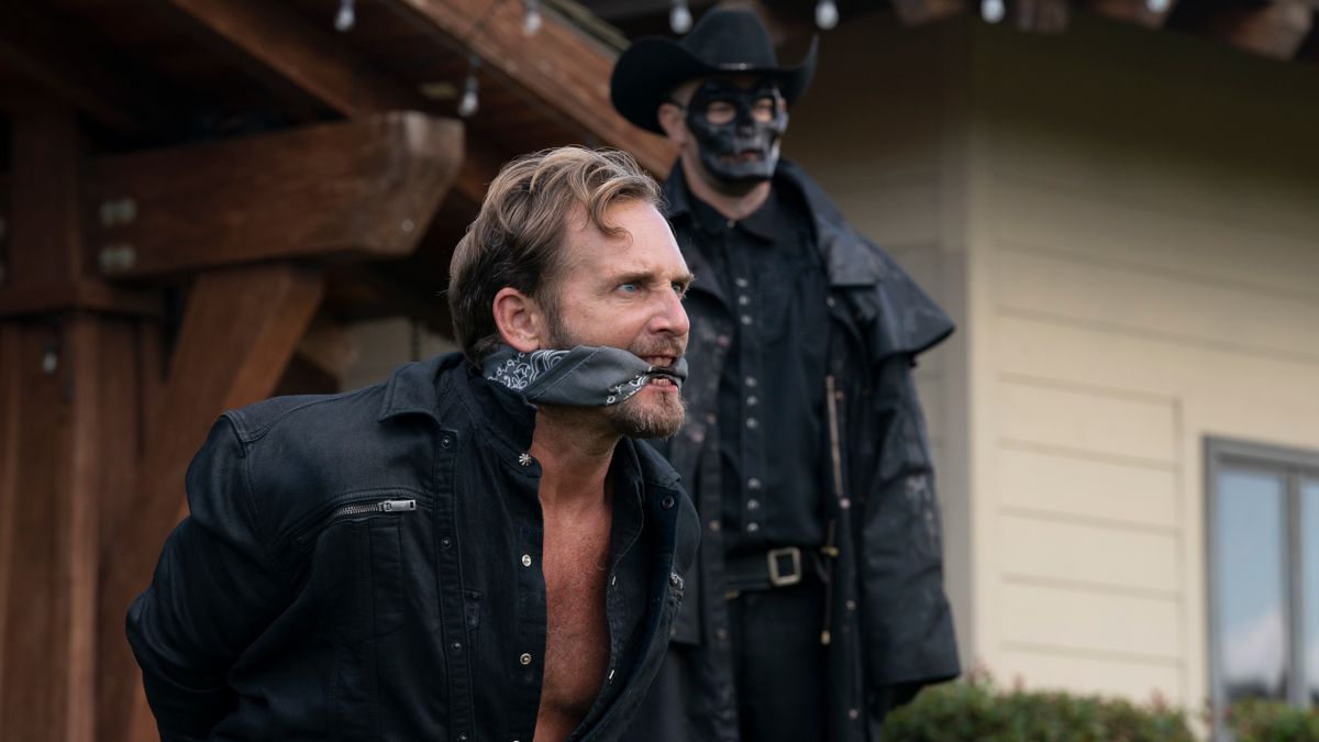 Josh Lucas struggles as he&#039;s bound in front of a Purger in The Forever Purge.