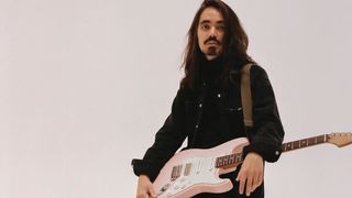 Mateus Asato with his signature Suhr guitar