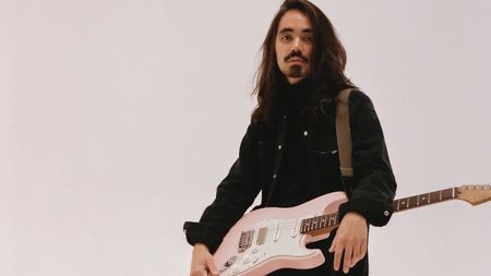 Mateus Asato with his signature Suhr guitar
