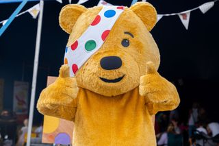 Pudsey Bear posing with his thumbs up for Children in Need 2022